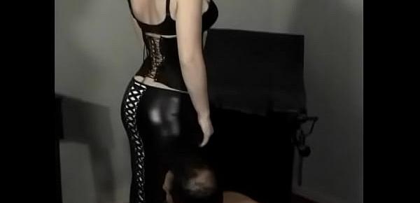  Hot bitch in a leather suit lets a muscular dude lick her legs